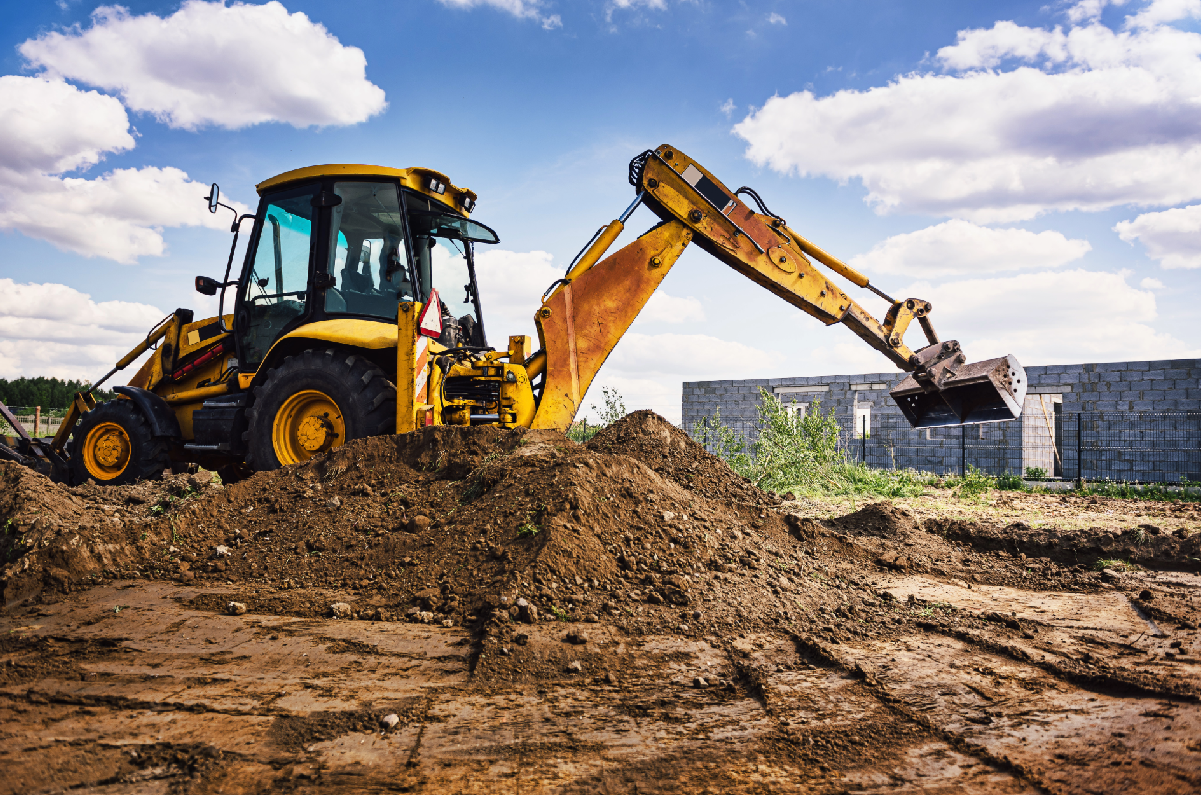Back Hoe on a pile of dirt